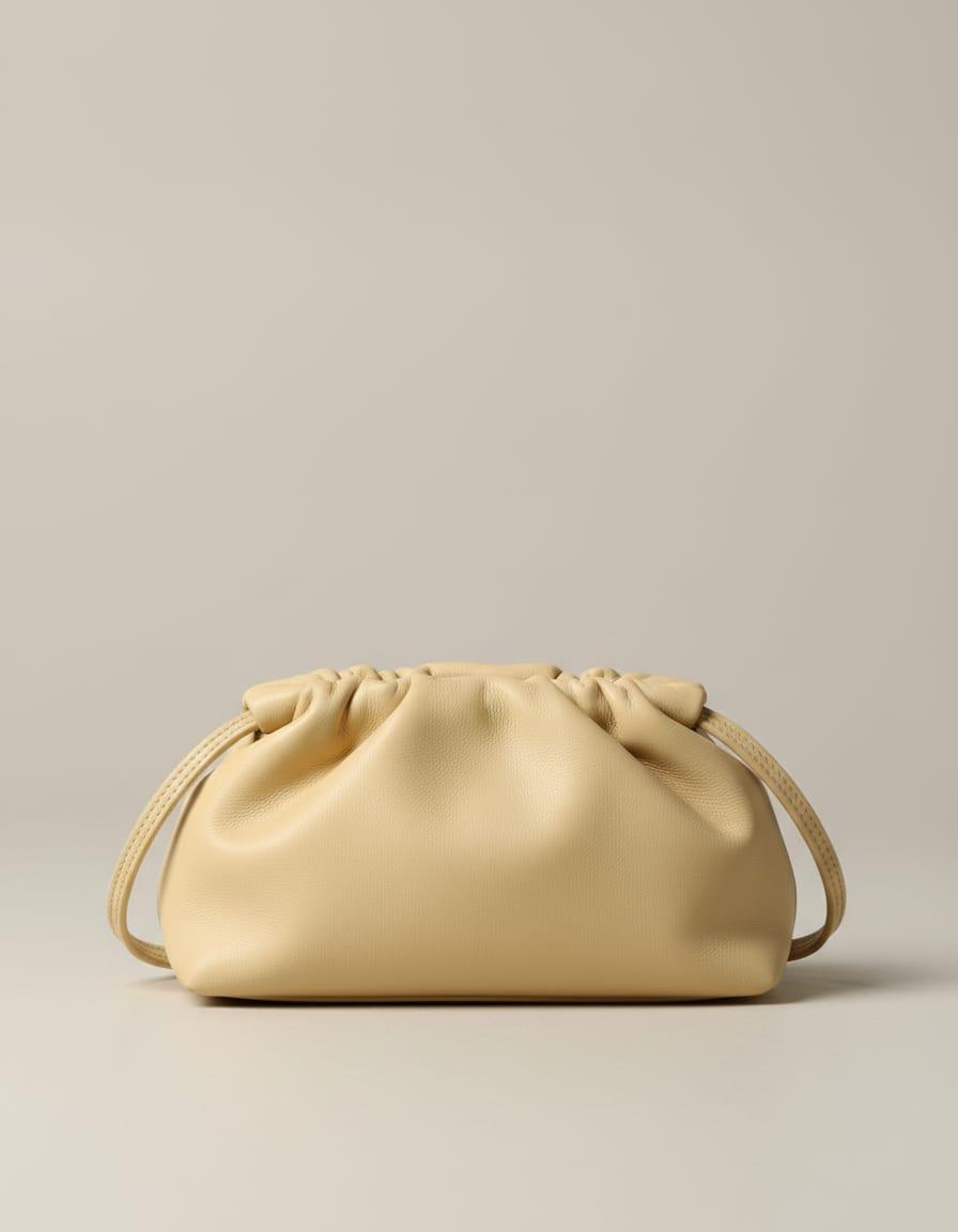 Palma Shoulder Pouch, front view on a studio backdrop